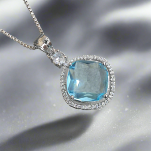 Aqua blue pendant with CZ studs on a silver-plated chain, perfect for any occasion by Garimas.