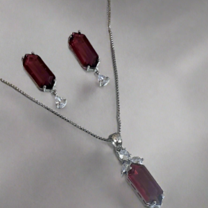 Elegant Garimas pendant set with red ruby and CZ stones on silver-plated chain, perfect for any occasion.