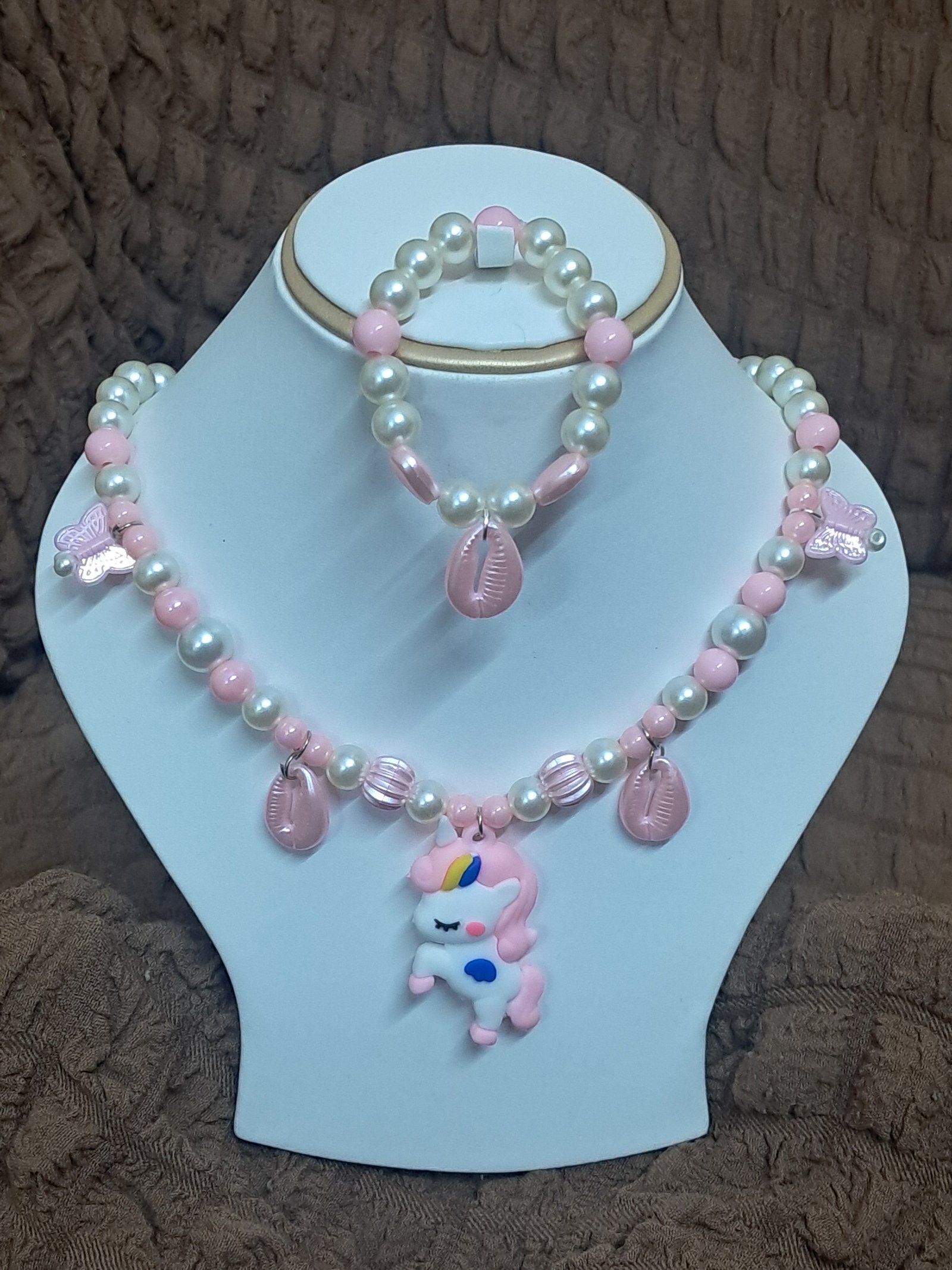 rn-image_picker_lib_temp_2aac0e8a-a5b1-4fca-8376-6704d39be71d Baby Pink Pearl Beaded Unicorn Necklace and Bracelet Set for Girls | GARIMAS